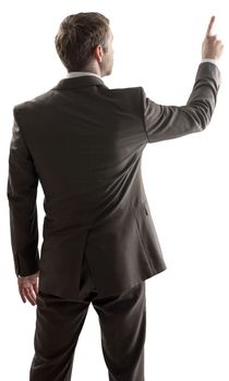 Rear view of young business man pointing at copy space isolated on white background