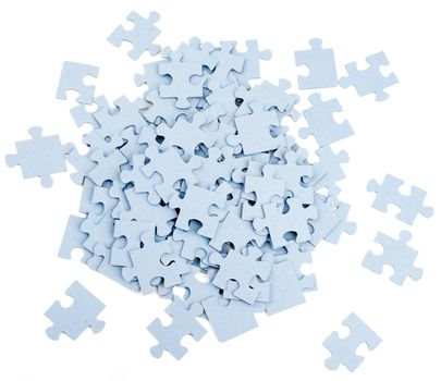 Pile of grey blank puzzle pieces isolated on white background, top view