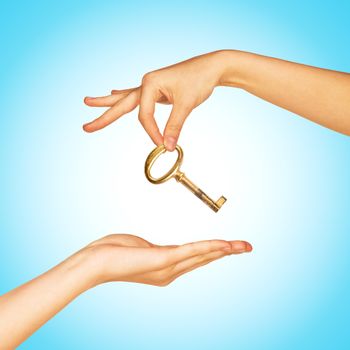 Hand giving key to another hand. Giving help, opportunity, success concept