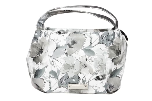 The photograph shows a female handbag on a white background