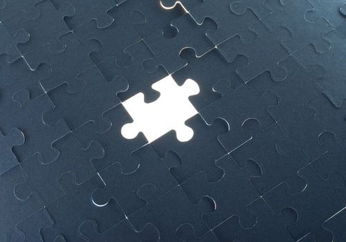 Grey puzzle background with empty space, close up view