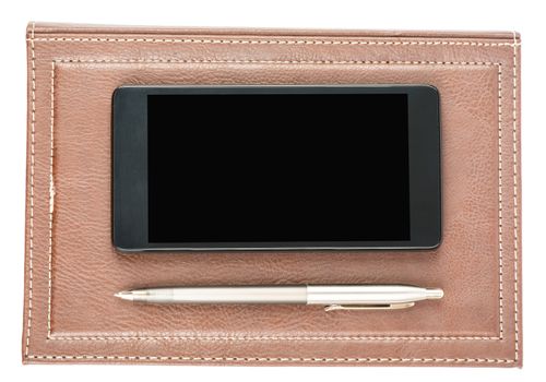 Leather daily planner with pen and smartphone on isolated white background