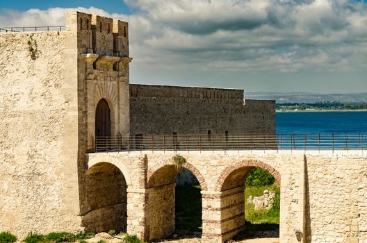 Entrance of medieval Maniace's Castle in Siracusa