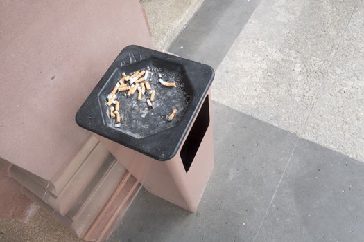 An image of an ashtray outdoors with space for your message