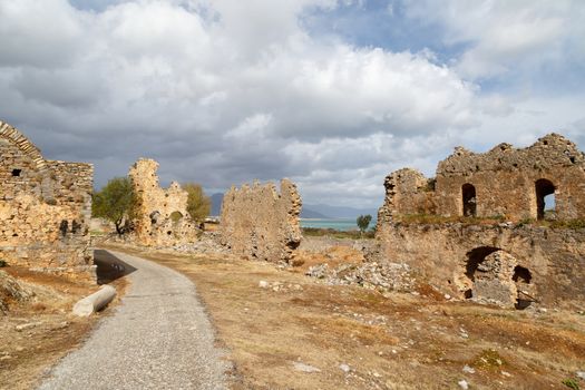 View of historical old area in Anemurium ancient city in Mersin, on cloudy blue sky background.