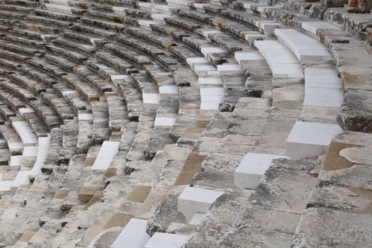 View of amphitheater with historical old granit stairs in Aspendos Ancient City.