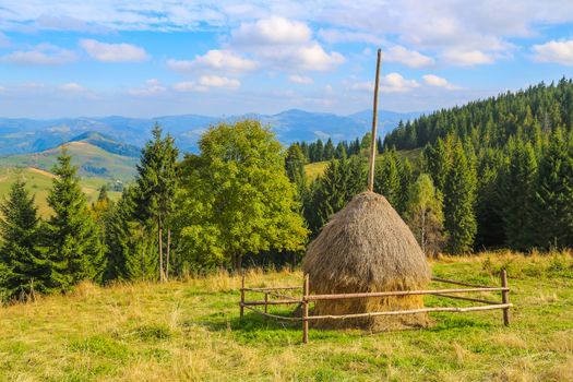 Haystack Mountain was shot in a bright, sunny day. Mountains visible to the horizon.