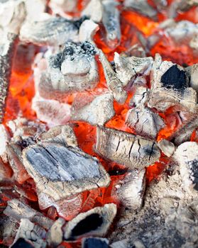 Background of Big Pieces of Live Coals closeup Outdoors. Selective Focus