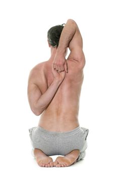 man doing yoga in front of white background