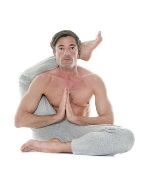 man doing yoga in front of white background