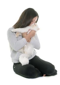 white persian cat and teenager in front of white background