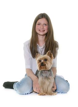 yorkshire terrier and teenager in front of white background