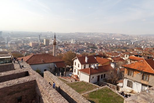 Cityscape view with old small houses from historical Ankara Tower on cloudy sky background.