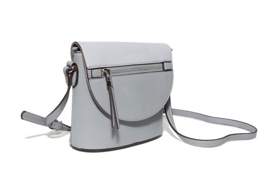 The photograph shows a female handbag on a white background