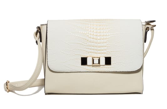 The photograph shows a female handbag on a white background