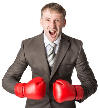 Angry businessman in boxing gloves isolated on white background