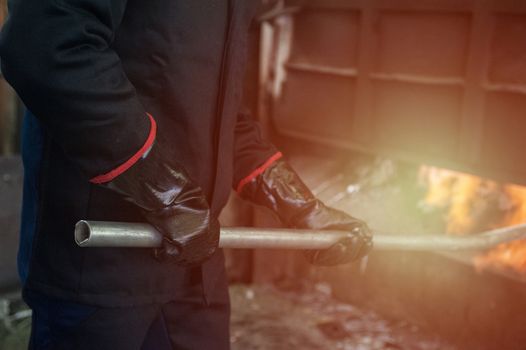 Industrial worker in metal melting factory