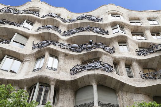  Casa Mila known as La Pedrera - facade with balconies of modernist building designed by Antoni Gaudí,  Barcelona, Spain