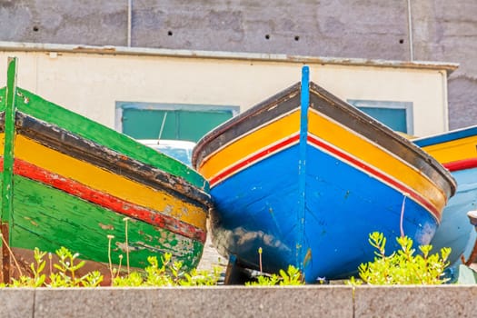 Colorful old fishing boats at land