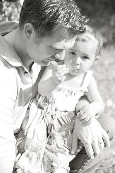 Father and daughter outside in the field