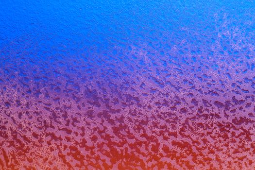 Abstract background. Sunset across a frozen glass