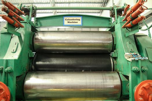 Calandering Machine use rolling the Material for prepare to produce part of printing industry