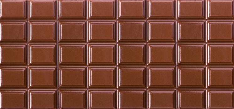 background of natural milk chocolate blocks close-up