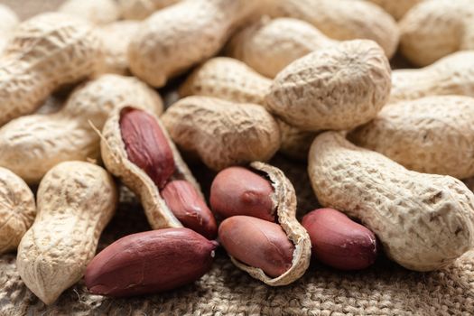 groundnut in the skin close-up on vintage background