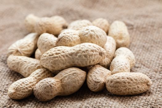 groundnut in the skin close-up on vintage background