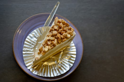 Piece of Coffee Cake with slice nuts topping.