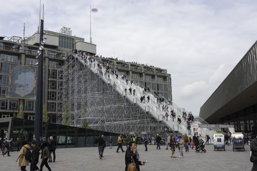 ROTTERDAM,HOLLAND-MAY 18, Unidentified  people at a giant staircase with 180 steps from the station to the Groothandelsgebouw on May 18 2016 in Rottrerdam, a nod to 75 years rebuilding the city