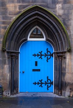 Old wooden blue castle door in Scotland