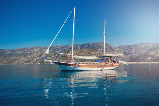 yacht on bay and castle in Kekova, near ruins of the ancient city on the Kekova island, Turkey