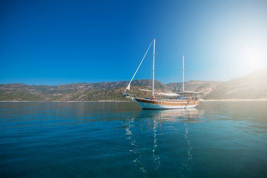yacht on bay and castle in Kekova, near ruins of the ancient city on the Kekova island, Turkey