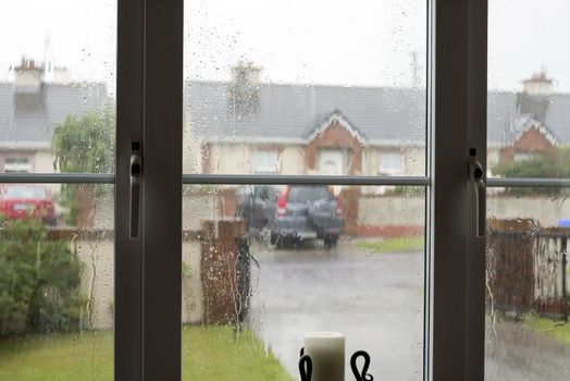 looking out the window on a wet and gloomy winters day