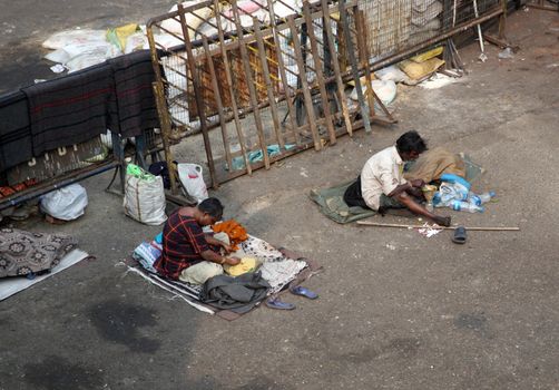 Beggars in front of Nirmal, Hriday, Home for the Sick and Dying Destitutes, one of the buildings established by the Mother Teresa and run by the Missionaries of Charity in Kolkata, India on January 24, 2009.