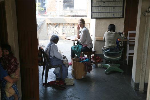 Sister of Missionaries of Charity and volunteers classified the goods they have received from charitable organizations in Kolkata, India on January 24, 2009.