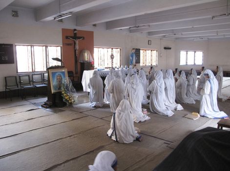 Sisters of Mother Teresa's Missionaries of Charity in prayer in the chapel of the Mother House, Kolkata, India at January 27, 2009