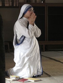 Sisters of Mother Teresa's Missionaries of Charity in prayer in the chapel of the Mother House, Kolkata, India at January 27, 2009