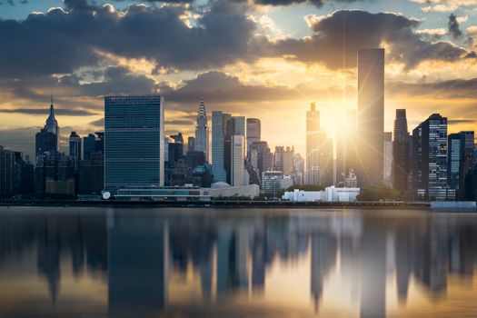 New York City skyline with urban skyscrapers at sunset, USA.