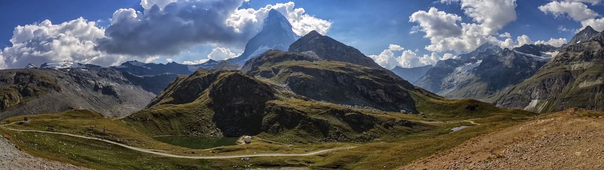 Matterhorn and Alps mountains panorama surrounded with clouds by day, Zermatt, Switzerland