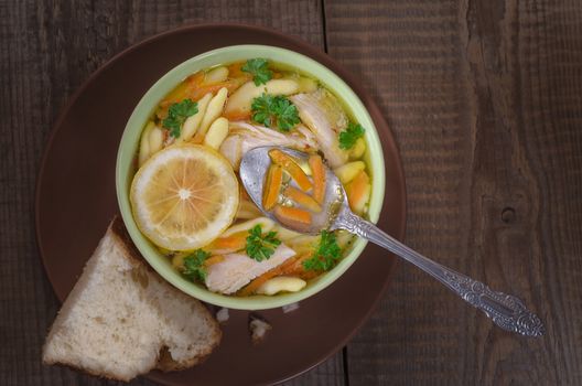 Italian soup and bread, on the old boards, low key.