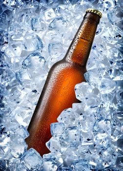 Brown bottle in ice isolated on white