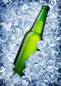 Green bottle in a cold blue ice 