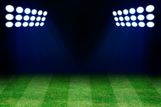 Two spotlights on football grass field. Empty place for text or product