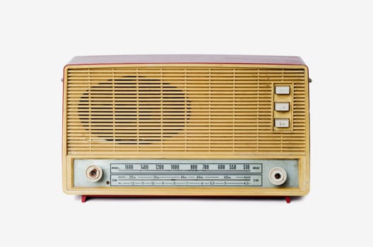 Old dusty radio from 1970 isolated on white background, retro style