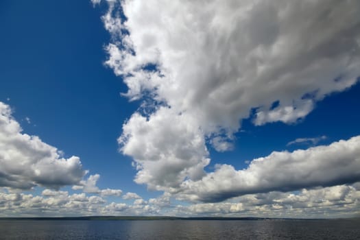 Blue sky with clouds over sea. Nature composition.