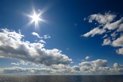 Blue sky with clouds over sea. Nature composition.