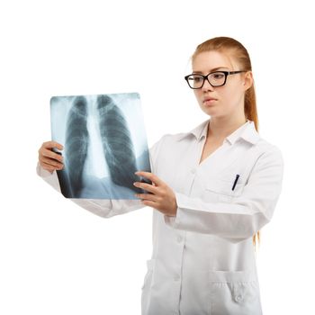 Young beautiful woman doctor inspects an X-ray of the chest and spine isolated on white background