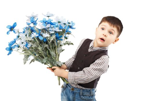 Funny little boy holding a large bouquet of flowers isolated on white background